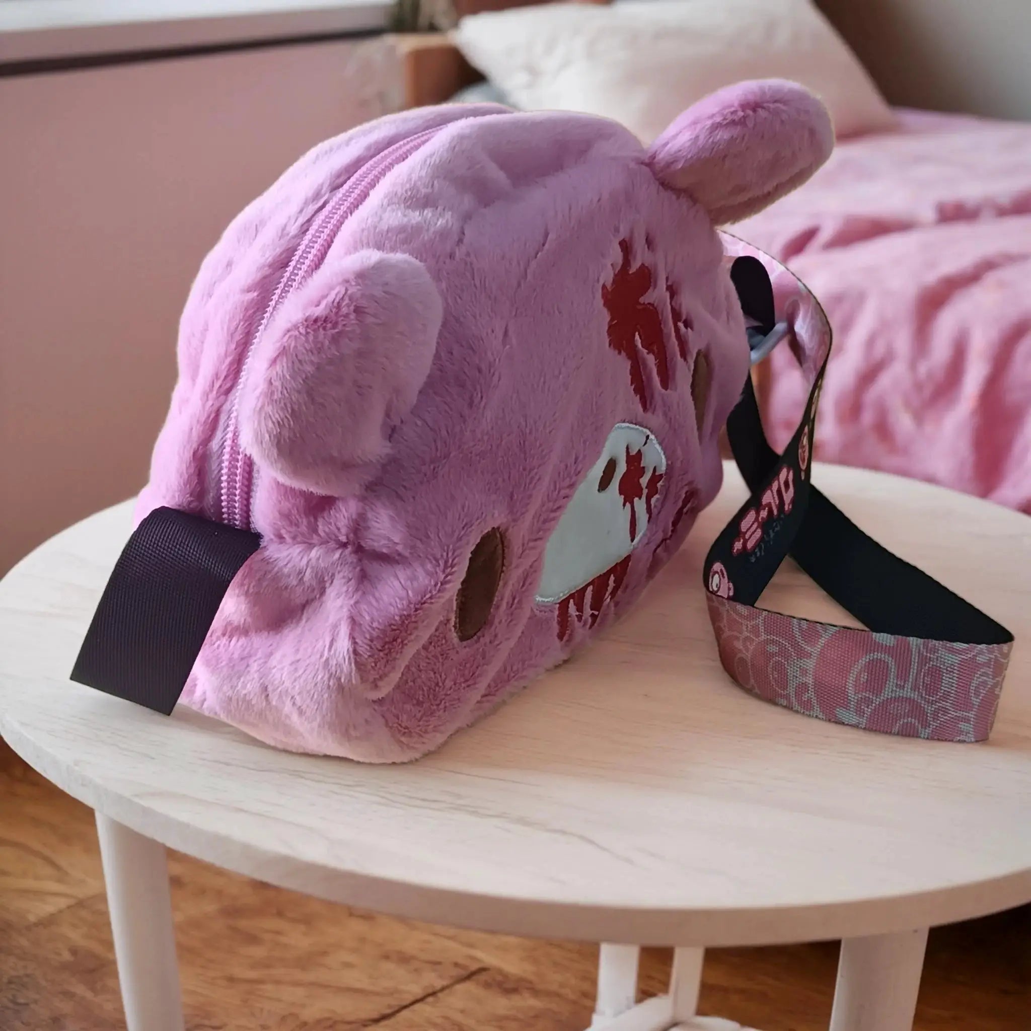 Gloomy Bear plush crossbody bag in pink with blood-splatter detailing; by Simples Market.