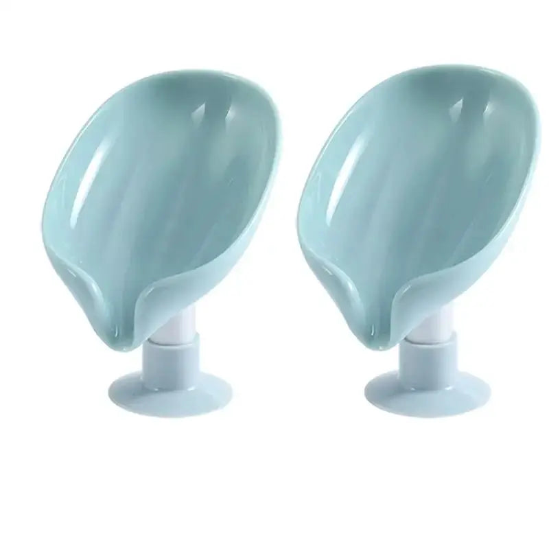 2-piece light blue suction cup soap holders with curved draining scoops.