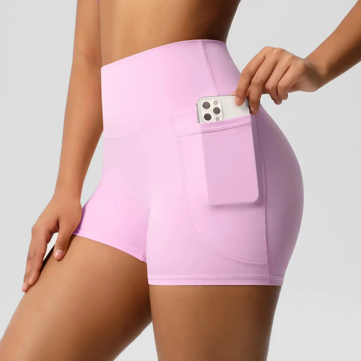 Women's pink high-waisted yoga shorts with side phone pocket, Simples Market