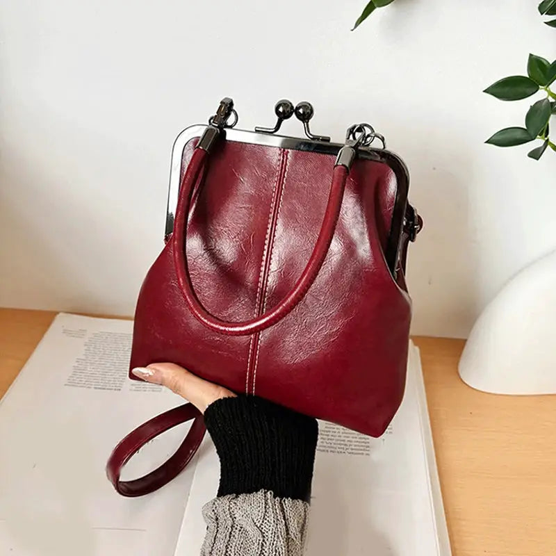 Vintage-style women's handbag, burgundy PU leather with metal frame clasp, shoulder bag