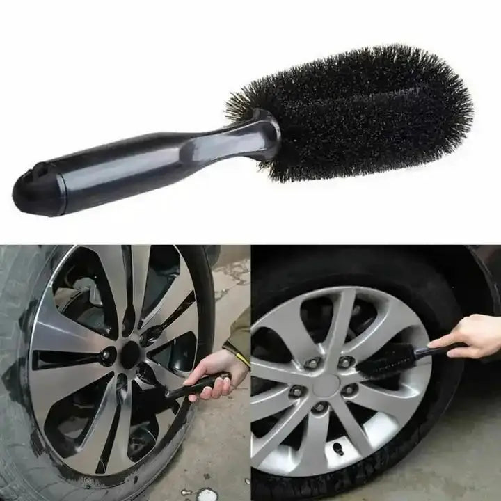 Car wheel cleaning brush with black bristles and ergonomic handle for wet or dry rim and tire cleaning.
