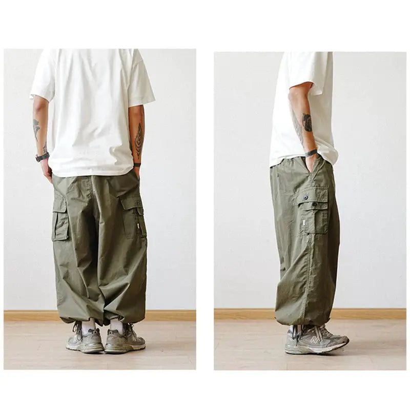 Simples Market multi-pocket oversized cargo pants in olive green for men, baggy wide-leg ankle jogger style.