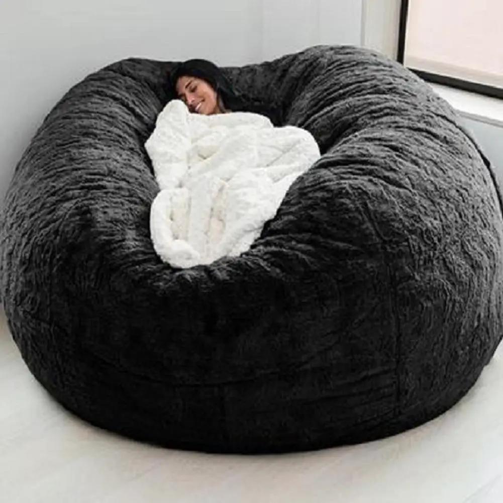 Bean bag sofa bed in black plush faux fur, oversized lounge chair.
