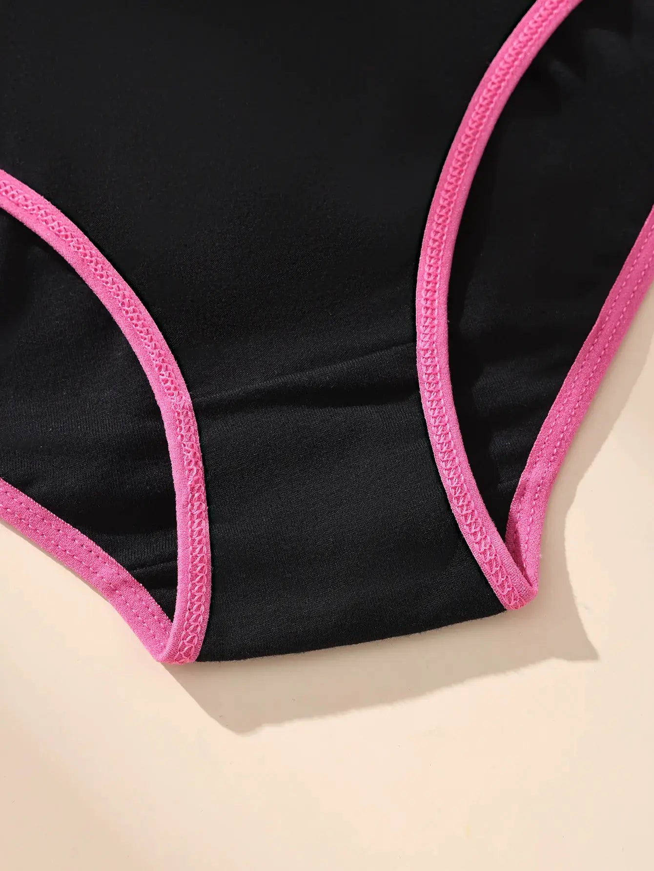 Black cotton panties by Simples Market with pink trim; women's breathable stretch underwear