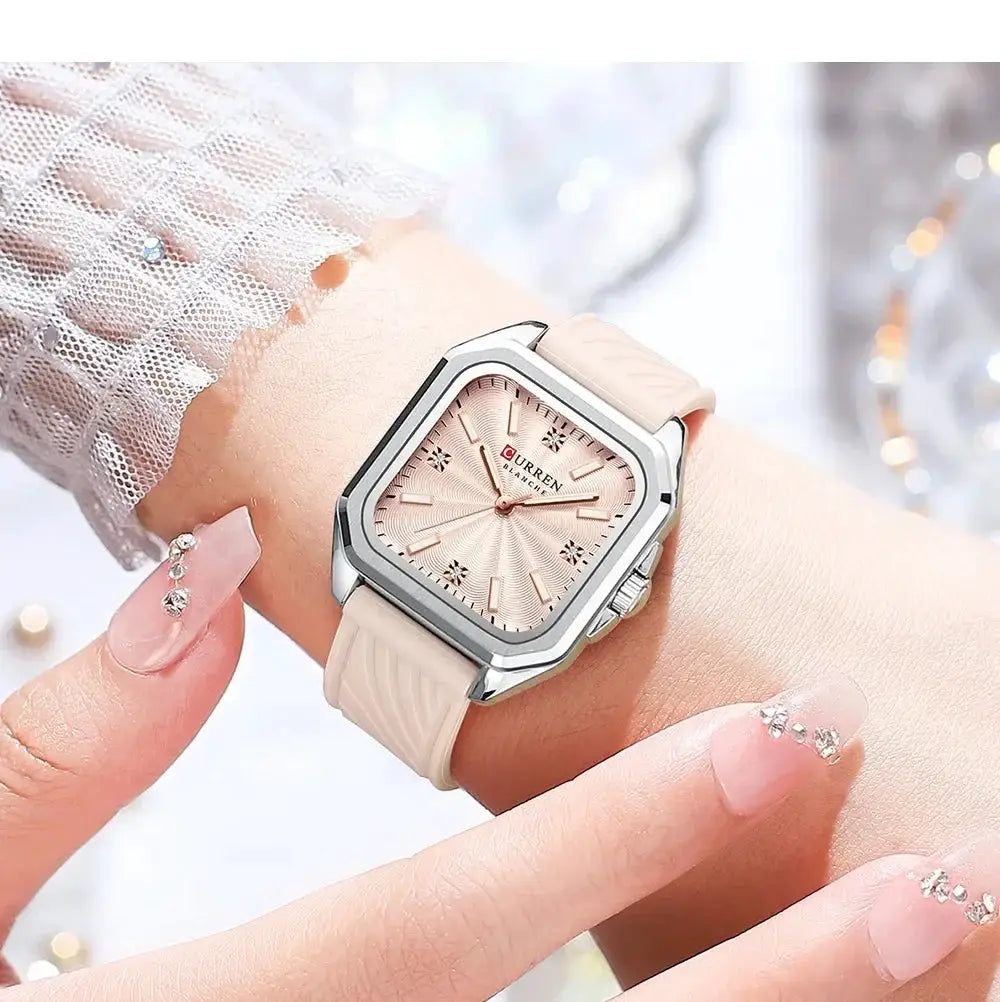 CURREN 9113 ladies' quartz watch on wrist, square rose-pink dial with beige strap, waterproof