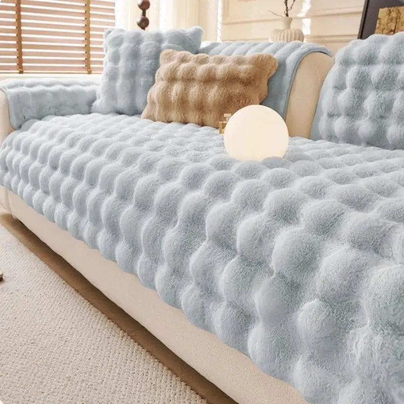 Simples Market thick faux rabbit fur sofa slipcover in light blue with matching plush cushions