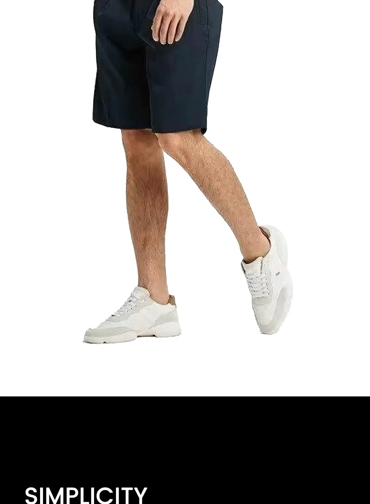 Men's navy shorts with white sneakers; casual summer look