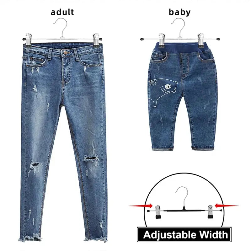 Black adjustable metal pants rack with anti-slip wardrobe clips; shown with adult and baby denim jeans.