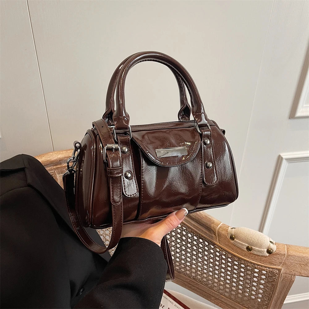 Burgundy mini top-handle bag by Simples Market in glossy PU leather with detachable shoulder strap
