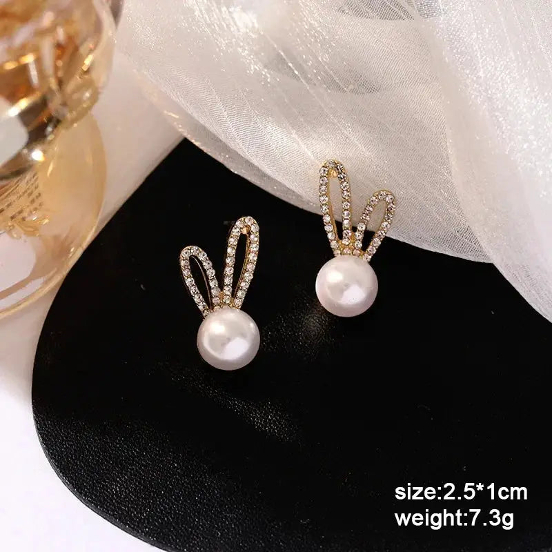 Simples Market women's pearl drop earrings with crystal-encrusted loops and gold-tone finish (set of 2)