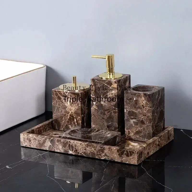 Emperador Dark marble four-piece bathroom set with gold pump dispenser, toothbrush holder, soap dish on a tray