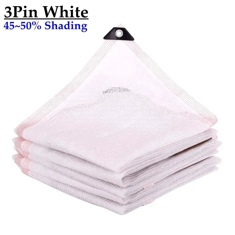 White HDPE shade net, 50% shading, folded stack with hanging loop and grommet