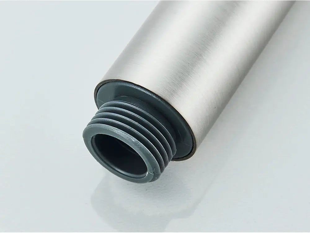 Hand held shower head by Simples Market with brushed metal body and gray plastic threaded adapter
