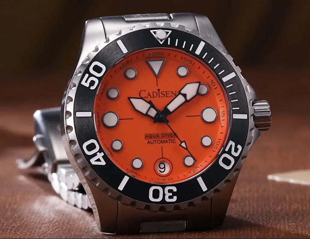 Cadisen Aqua Diver men's automatic watch with orange dial, black bezel, stainless bracelet, 100m water resistance.