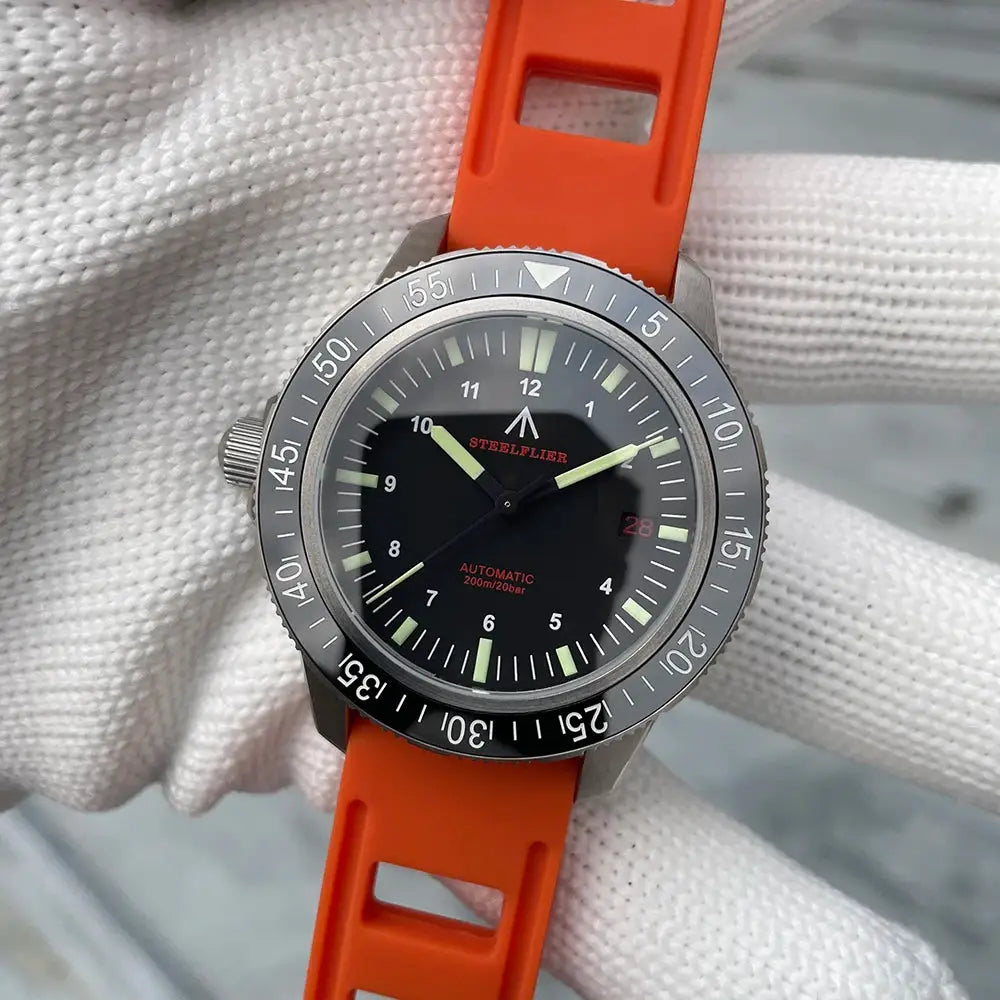 STEELFLIER SF783 automatic dive watch with orange silicone strap, gray bezel, luminous hands, date window.