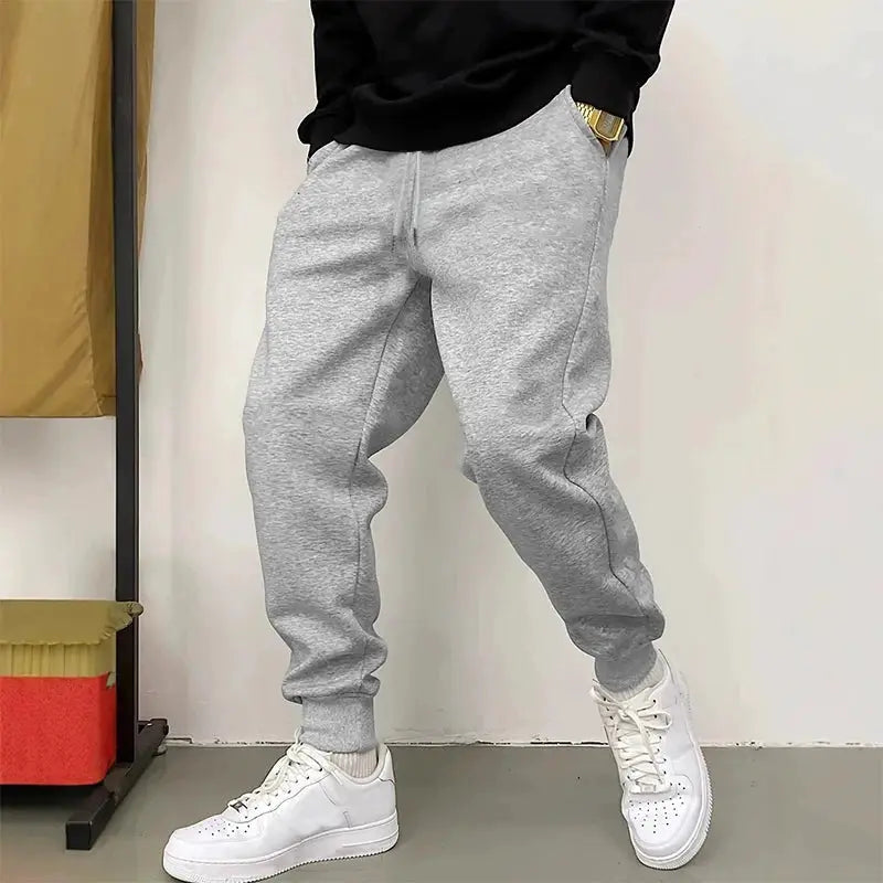 Men's sweatpants by Simples Market, grey jogger pants with cuffed ankles.