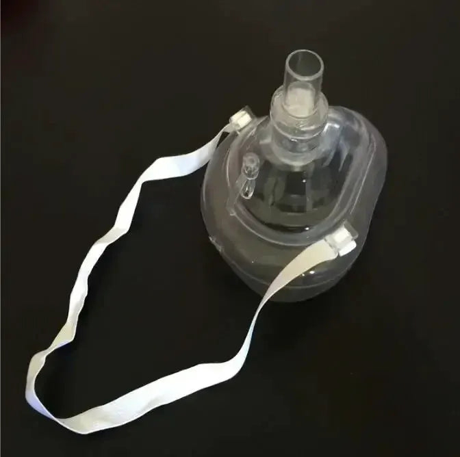 Simples Market CPR rescue mask with transparent resuscitator, one-way valve, and white strap.