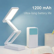 Folding LED desk lamp with adjustable arms; white finish, 1200 mAh rechargeable battery, eye-protecting light.