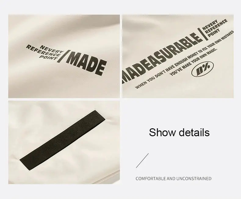 Two-sided reversible outdoor jacket; white fabric with black logo text and Velcro patch detail
