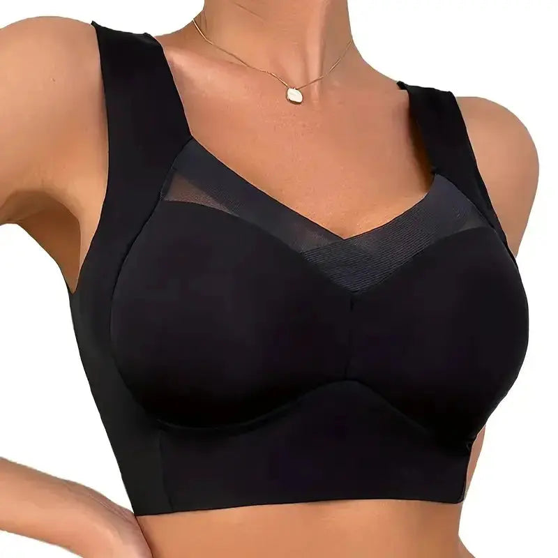 Women’s black seamless sports bra with mesh V-neck and padded chest, plus-size