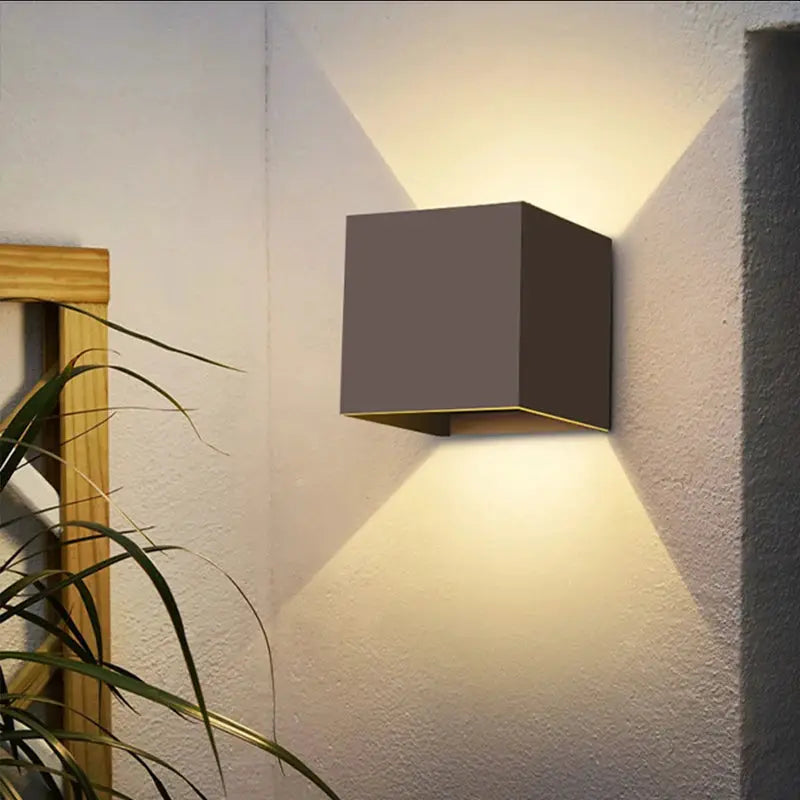 MARPOU LED wall lamp by Simples Market; square gray outdoor wall light with up-and-down warm white illumination.