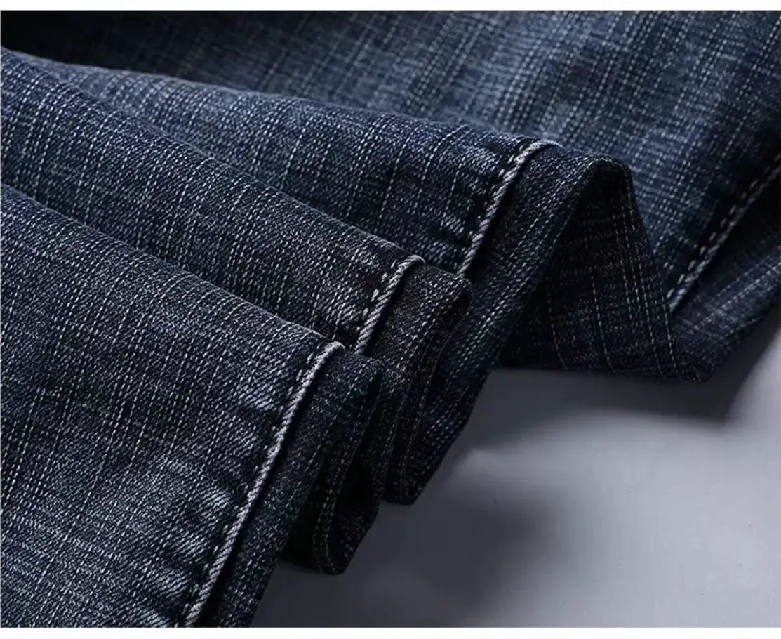 Men's denim jeans in blue, straight-stretch work pants with folded cuffs