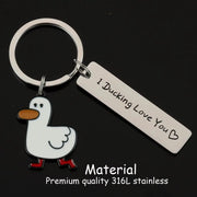 Funny duck keychain with white enamel duck charm, orange beak, red feet, and a tag reading I Ducking Love You on a silver ring