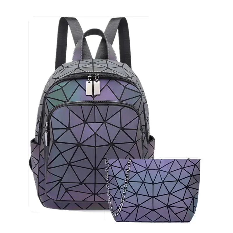 Backpack by Simples Market; luminous holographic geometric PVC with gradient purple tones; includes matching pouch.