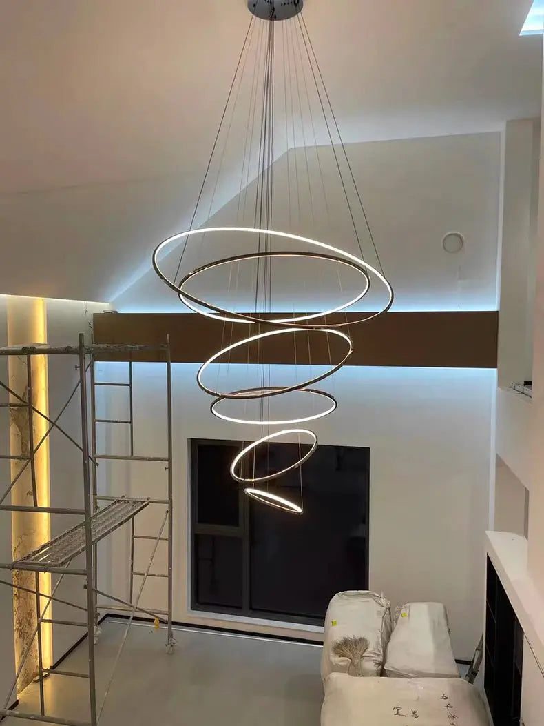 Pendant light with spiraling circular LED rings, modern metallic finish