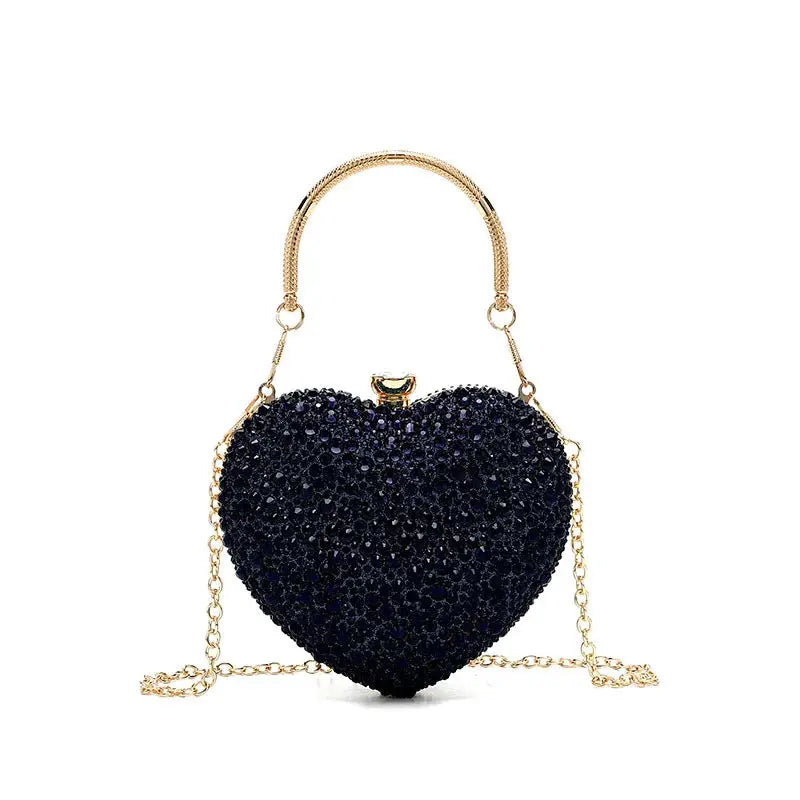 Heart-shaped crystal clutch purse with navy stones and gold-tone chain handle