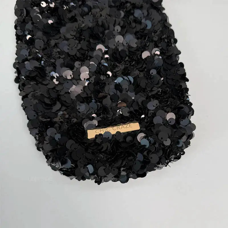 Leftside mini sequin shoulder bag in black with Chic Craze plate