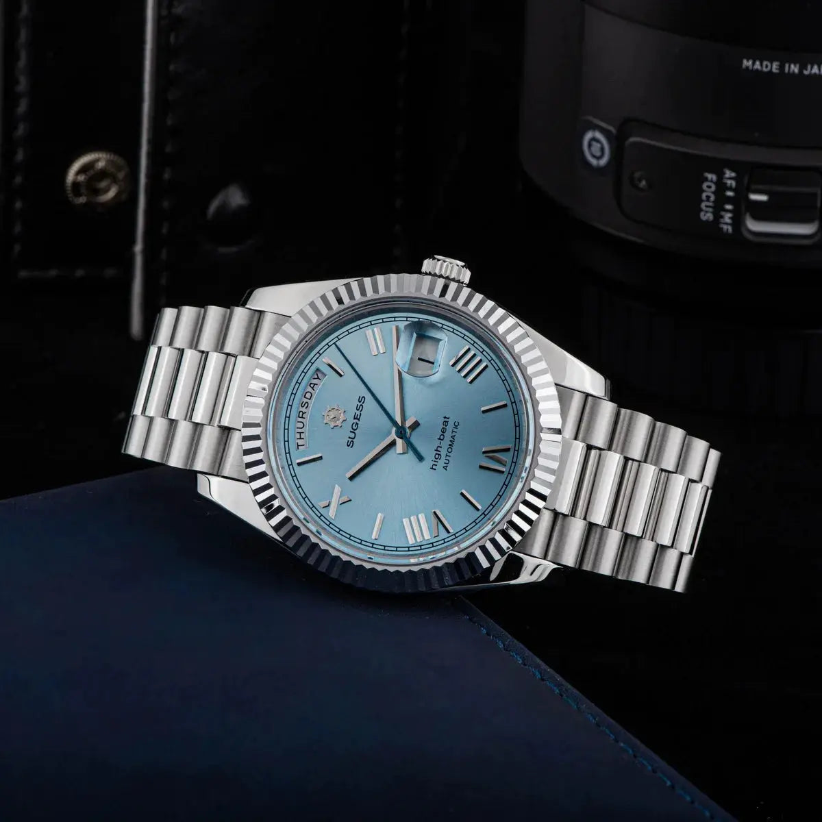 Sugess men's date-day automatic watch with blue dial and stainless steel bracelet