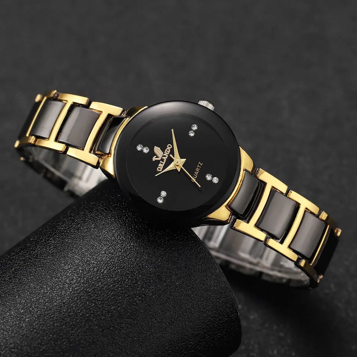 Fashion rhinestone women's watch by Simples Market with black dial and gold stainless steel band.