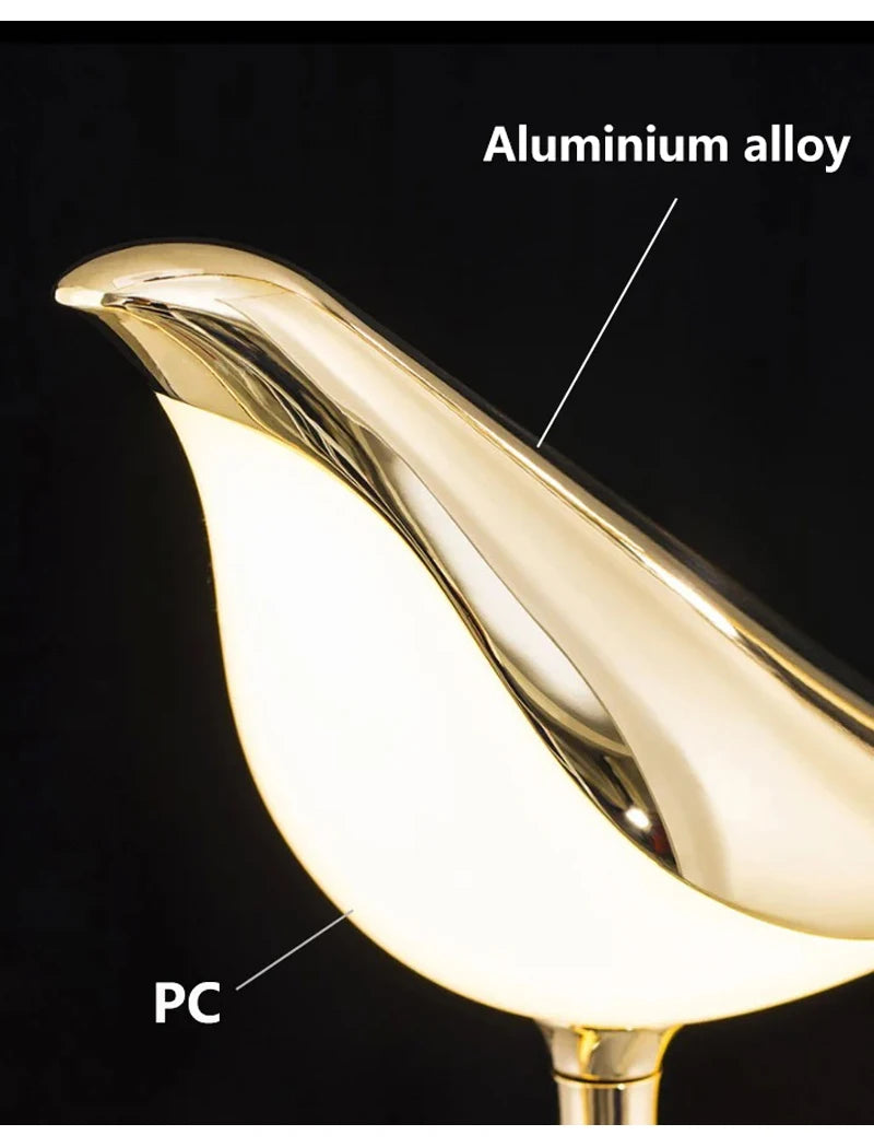 Magpie bird LED wall lamp with gold aluminium alloy finish and white PC body