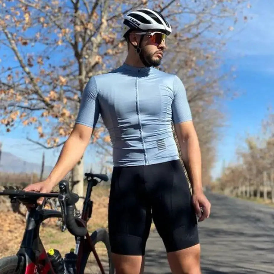 YKYWBIKE cycling jersey set with light blue short-sleeve jersey and black bib shorts by Simples Market