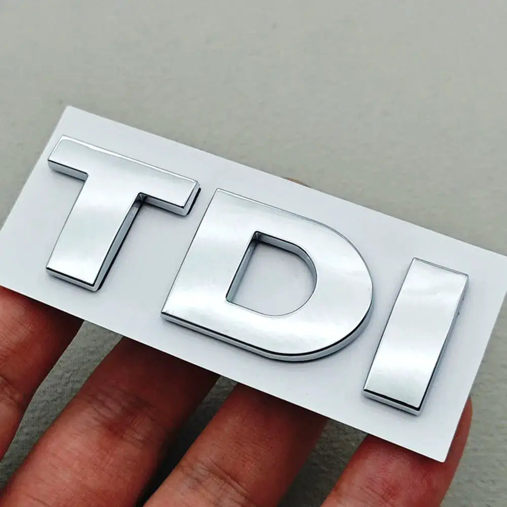 3D chrome TDI emblem badge for VW cars on a white backing plate