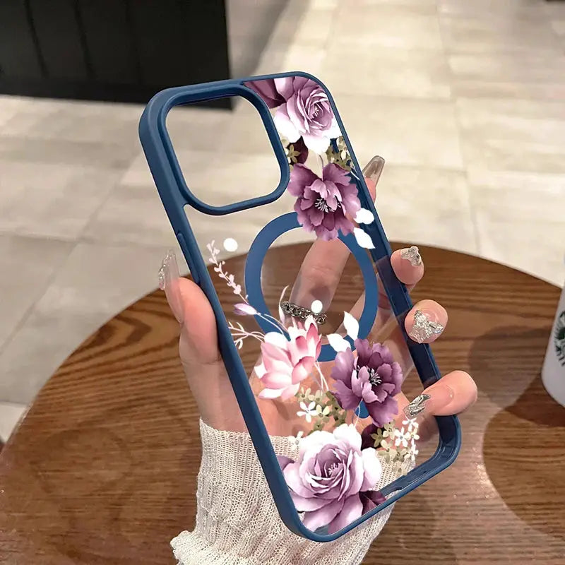 Wireless charging iPhone case with blue bumper and lavender pink floral print on clear back
