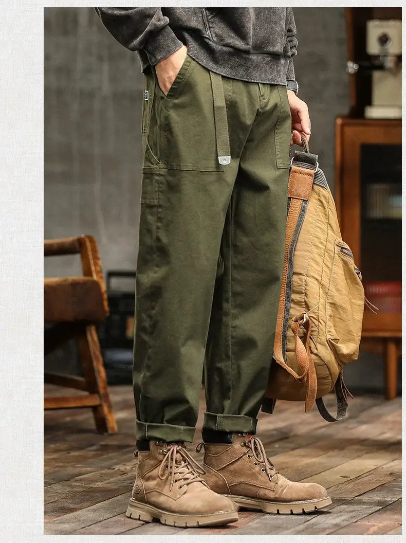 HIQOR men's loose profile cargo pants in army green with cargo pockets and rolled cuffs.