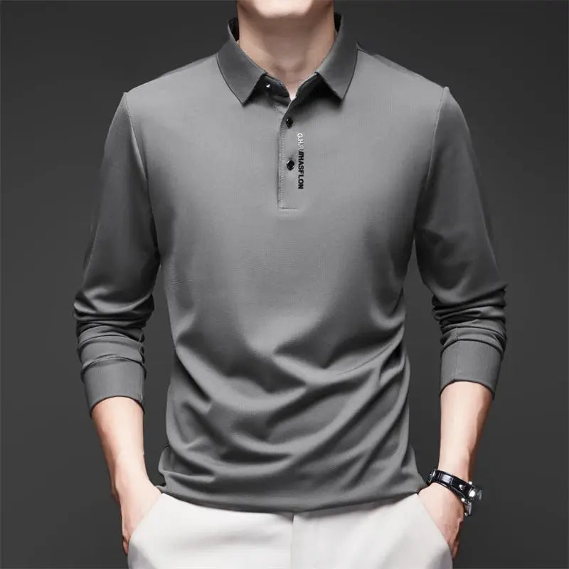 Men's grey long-sleeve polo shirt with collar and badge detail, breathable business casual top
