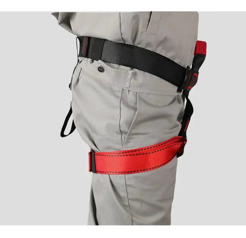 Rock climbing harness with red waist strap and black belt on grey pants from Simples Market