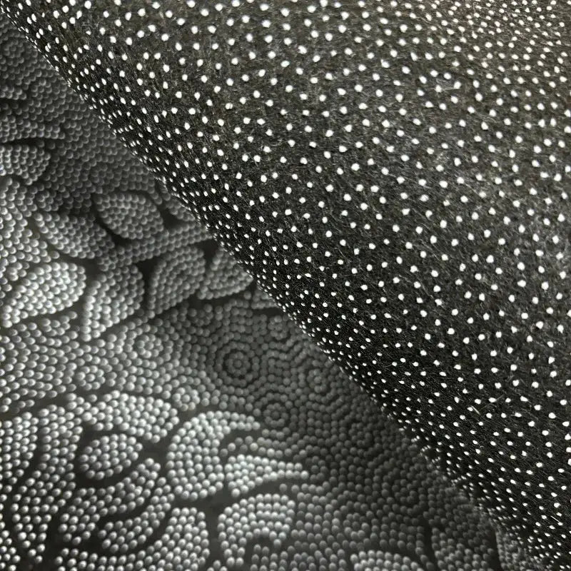 Cat-shaped area rug by Simples Market, dark with white polka dots, soft plush fabric.