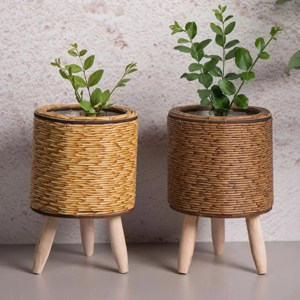 Rattan woven flower pot set with removable legs; two natural wicker planters on light wood legs