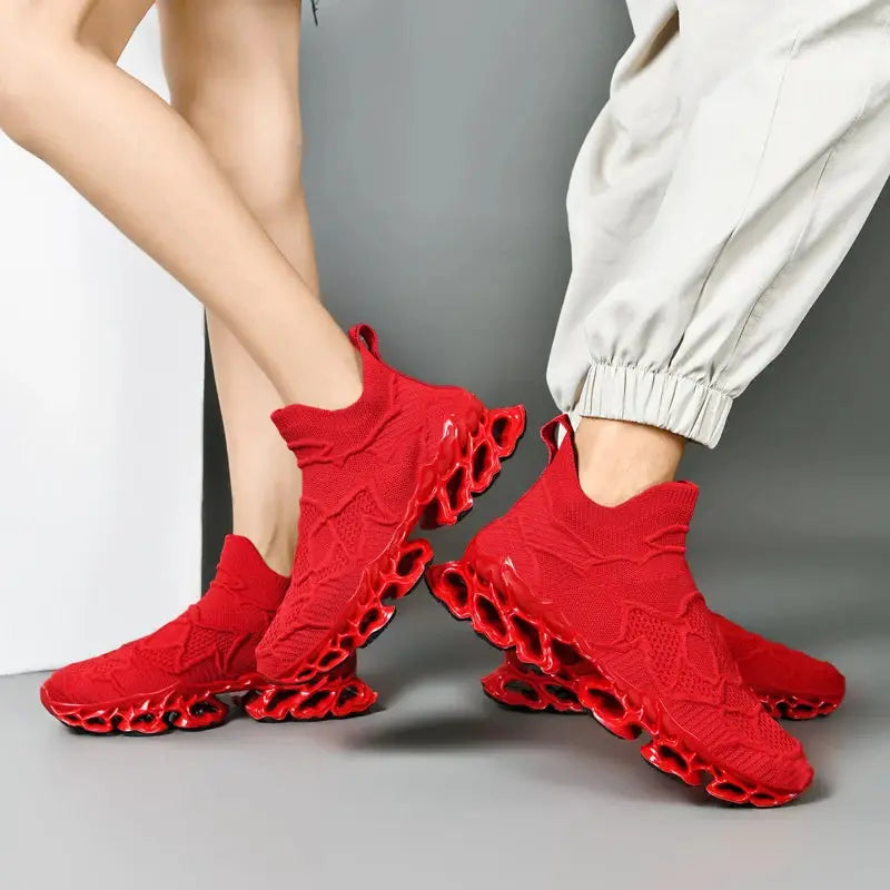 Pair of red sneakers with breathable knit upper and sculpted hollow outsole