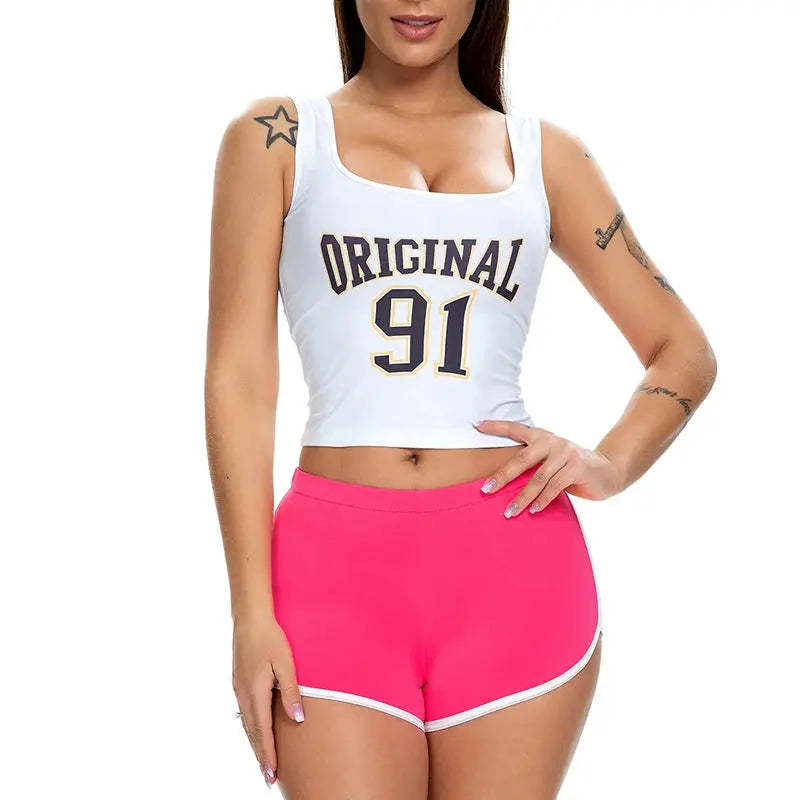 Pink women's shorts set with white trim, paired with a white crop top.