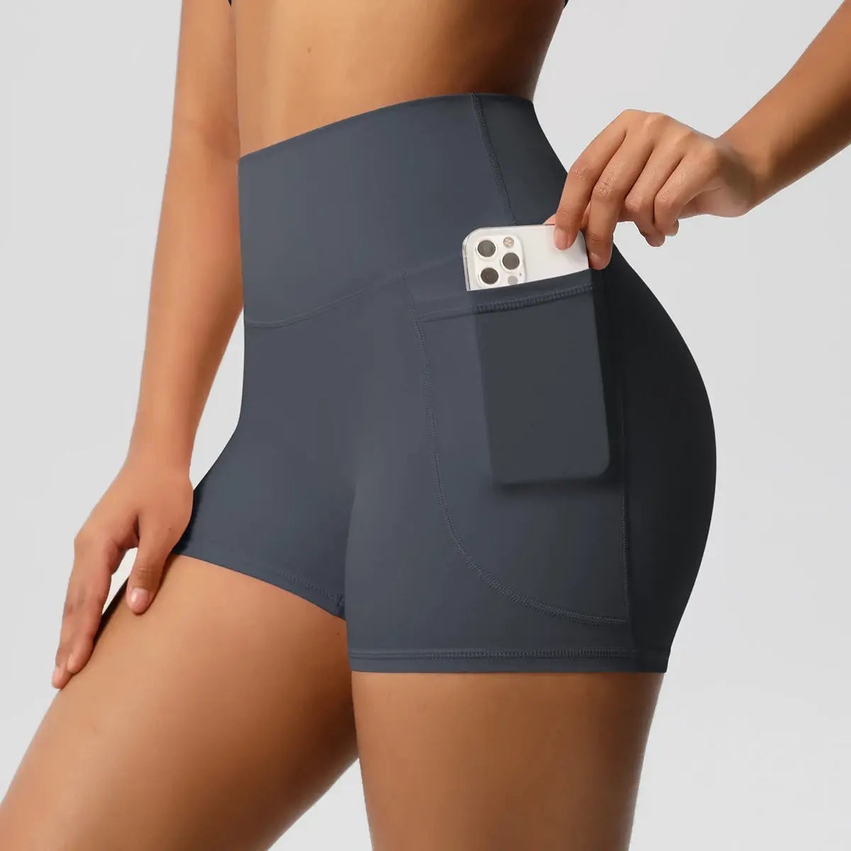 Women’s pocketed high-waist sport shorts in dark gray with a side phone pocket