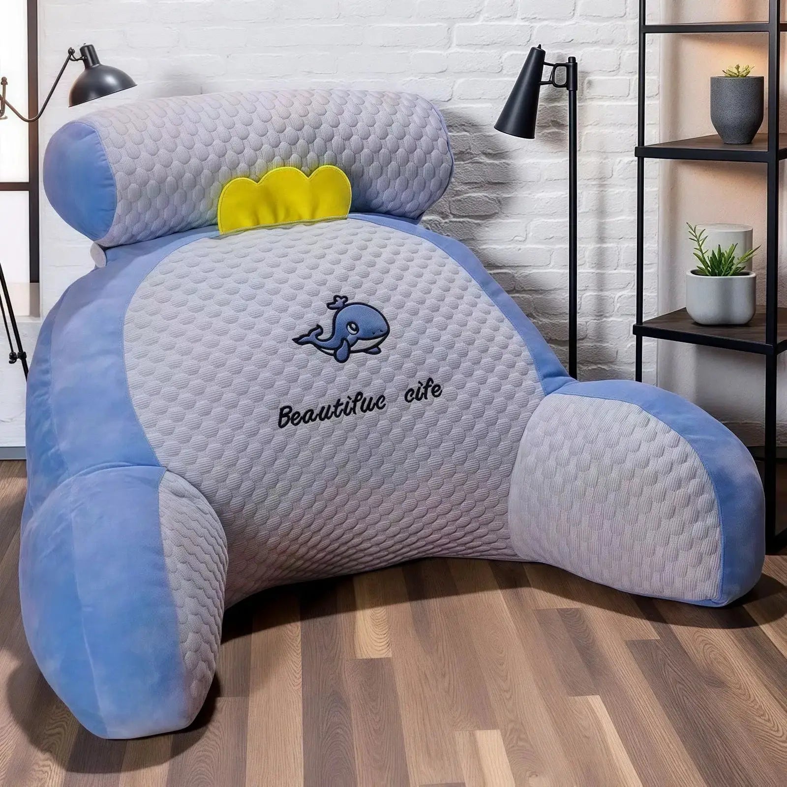 Adjustable reading pillow with gray quilted back, blue edging, and yellow neck support cushion