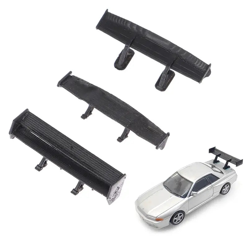 Set of four black 1:64 scale car rear spoilers with mounting pegs for model car DIY upgrades