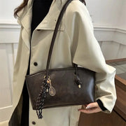 European American Retro Tote Bag by Simples Market in dark brown leatherette with shoulder straps and tassel pendant