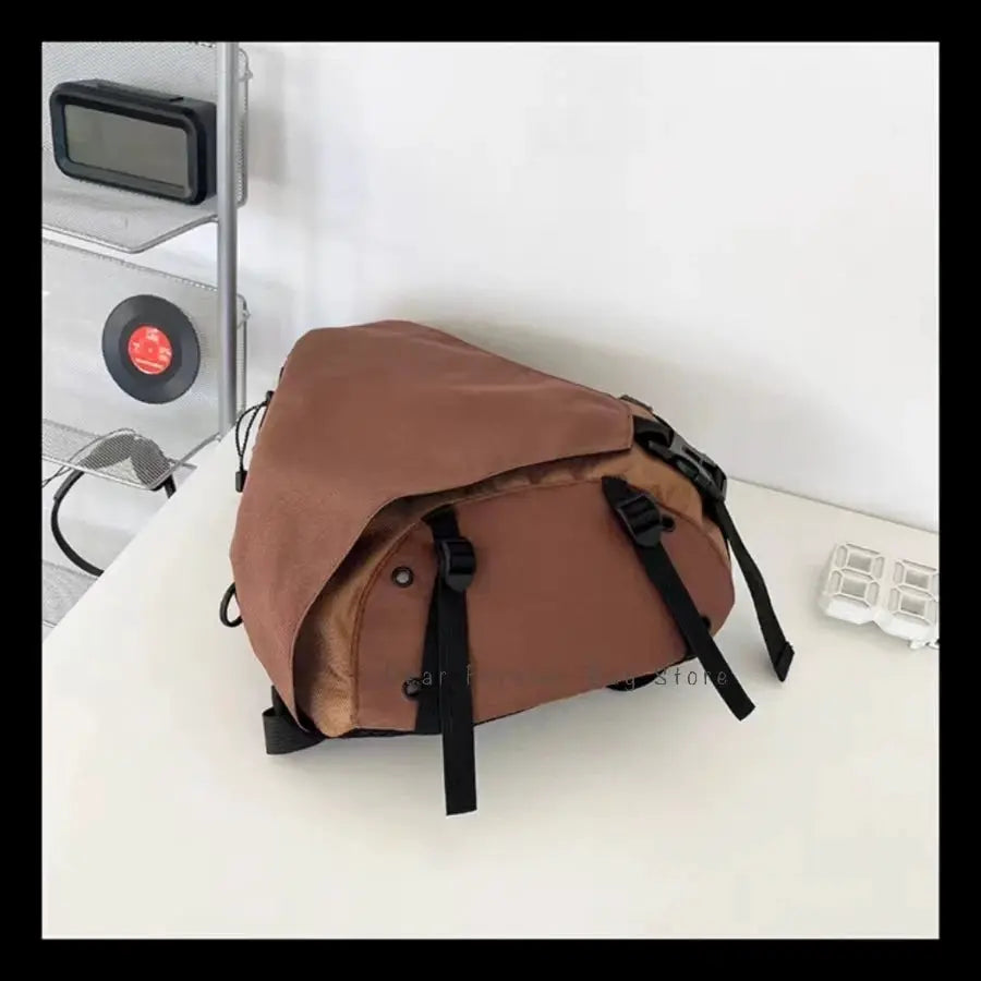 Simples Market tan nylon crossbody bag with black straps, unisex portable travel shoulder bag