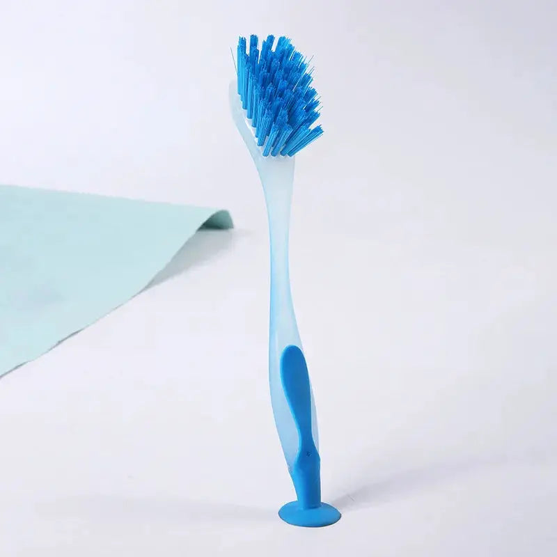 Pot cleaning brush with long blue handle and suction cup base